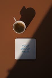 Coaster with the cup of coffee in the brown scene