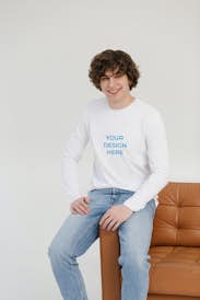 Man wearing a long-sleeved T-shirt sitting on the couch