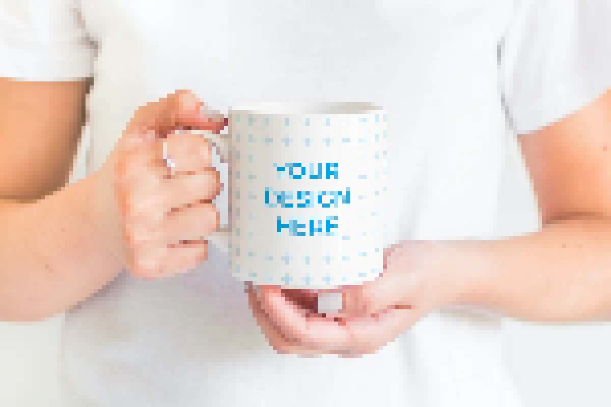 Ceramic mug in the hands of a woman