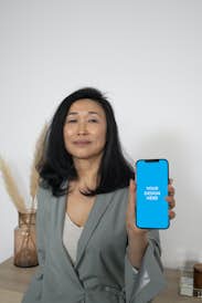 iPhone 12 Pro Max in the hand of an Asian woman